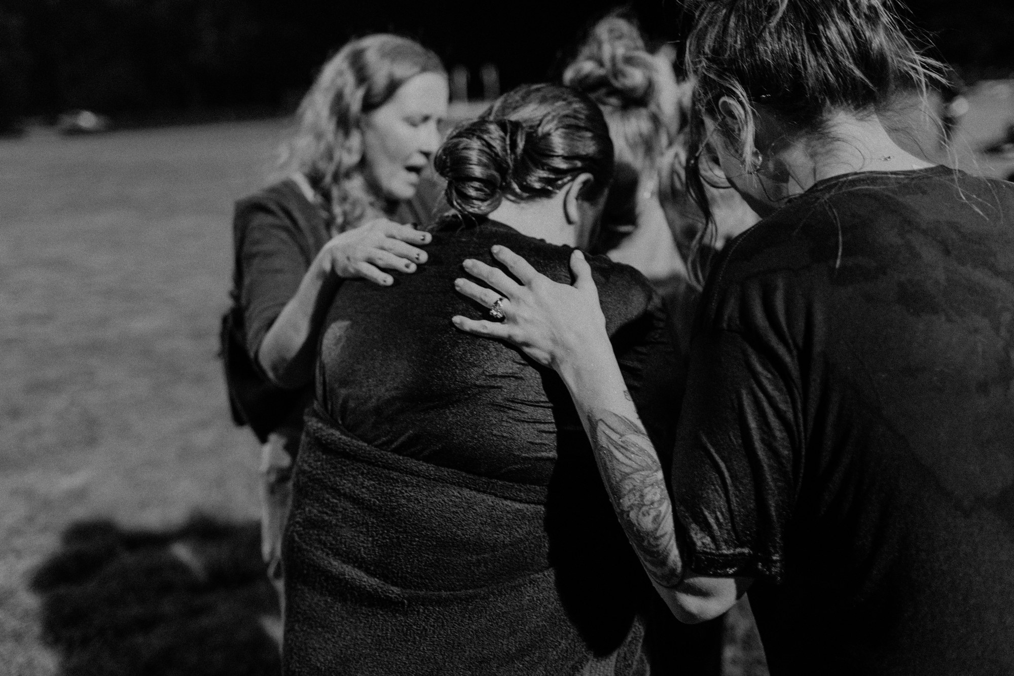 A group praying together at a Rise gathering