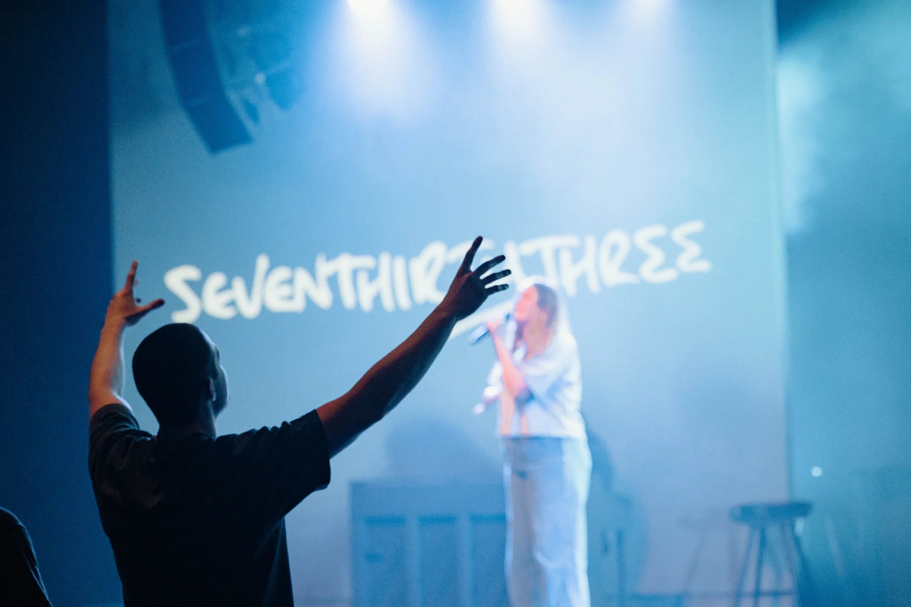 Young adults worshiping at SevenThirtyThree