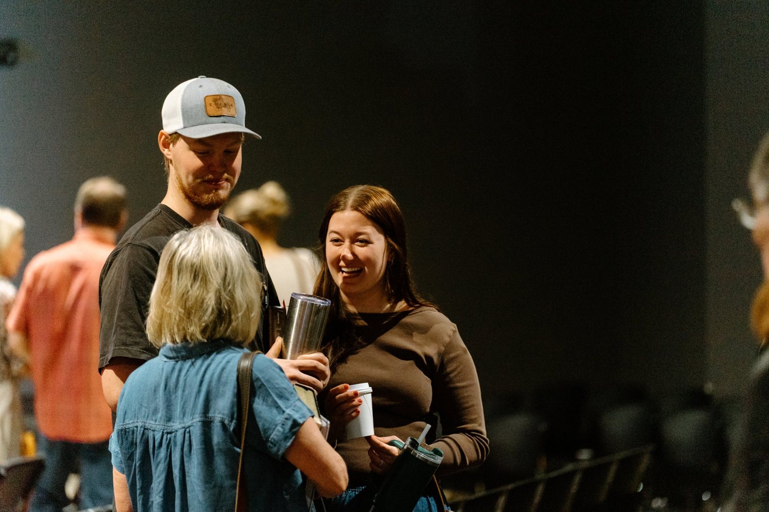 People connecting after a gathering at Rise