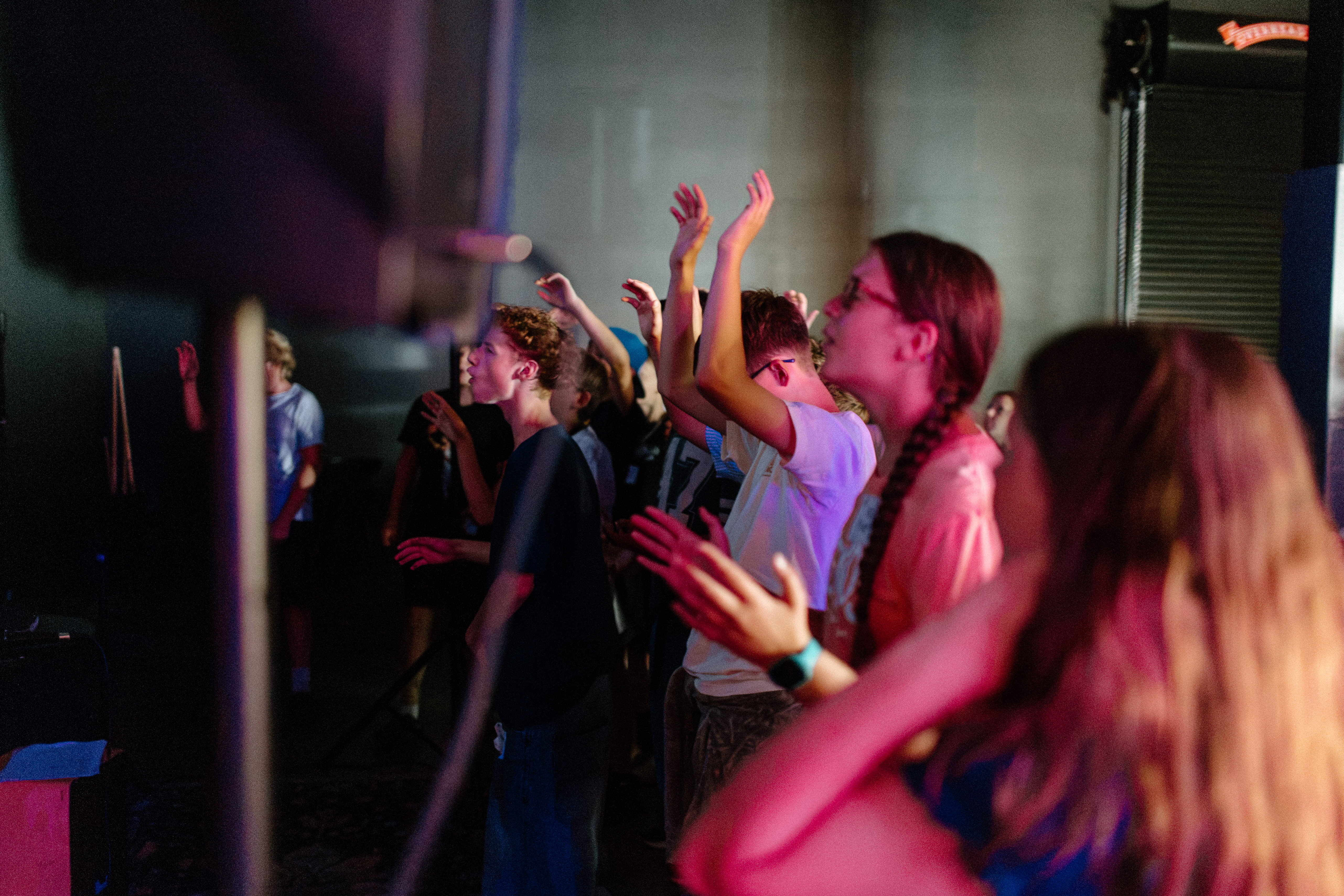 Students worshiping together at Rise Youth