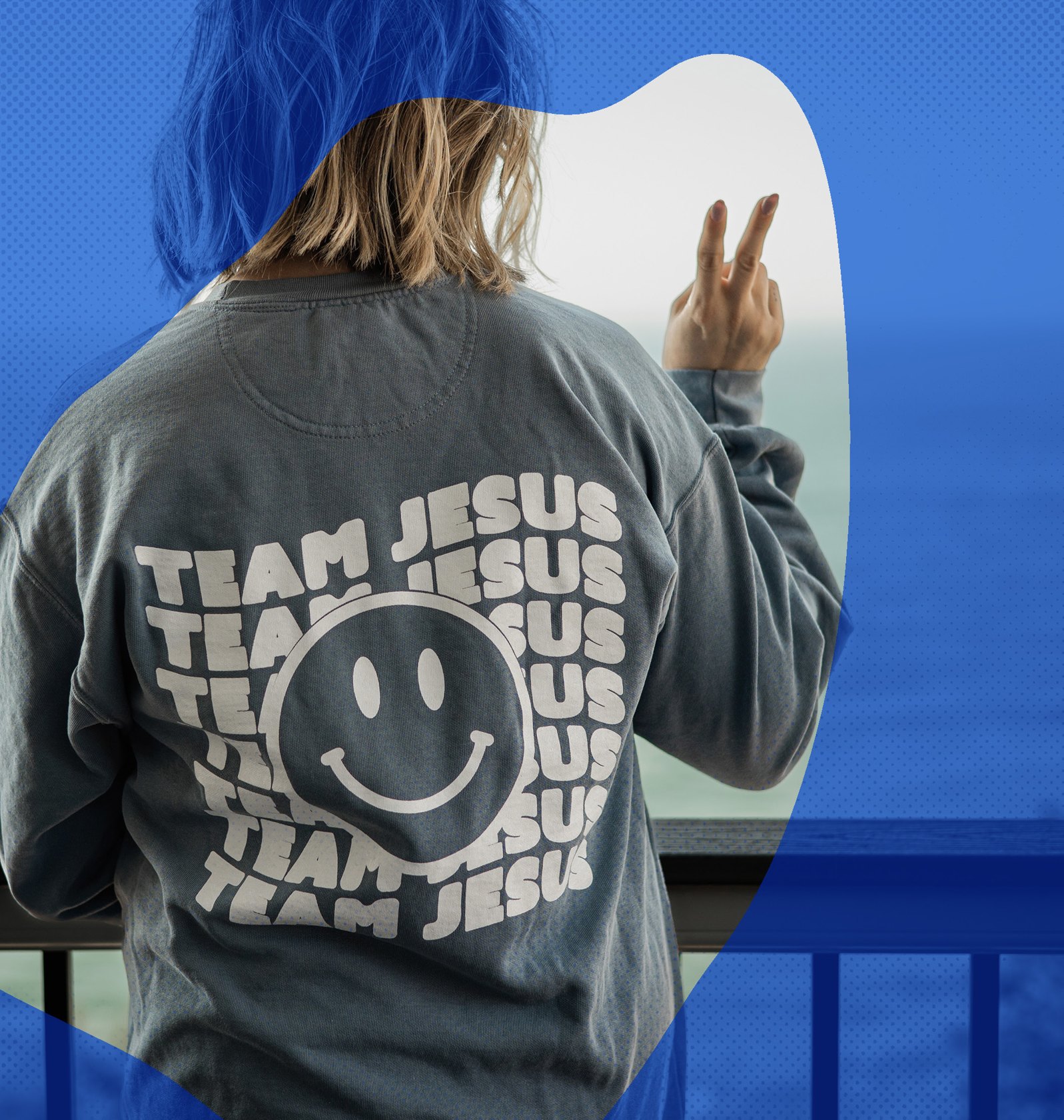 A person wearing a Team Jesus sweatshirt