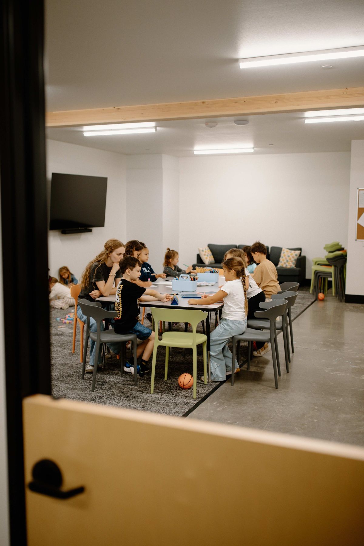 Children and a leader spending time together in a Rise Kids classroom